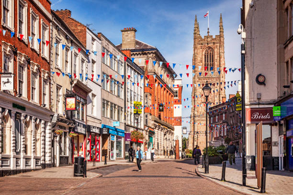 3 October 2016: Derby, England, UK - People shopping in Iron Gate in the centre of the city.