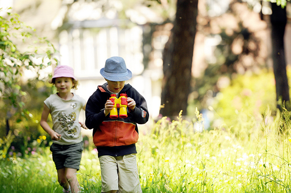 Children exploring the garden at Rufford Old Hall, Lancashire