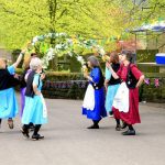 Ashover, Derbyshire, UK. May 04, 2015.  A group of female Garland dancers entertain at the village carnival at Ashover in Derbyshire.